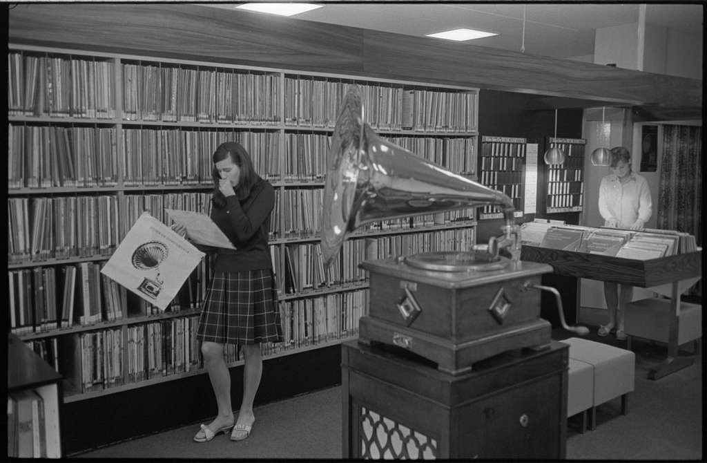 Collection of vintage vinyl records from different eras showing the evolution of album art and pressing quality